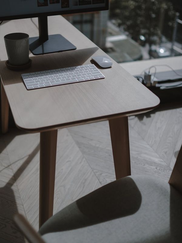 Minimalist workplace with natural light and wooden textures